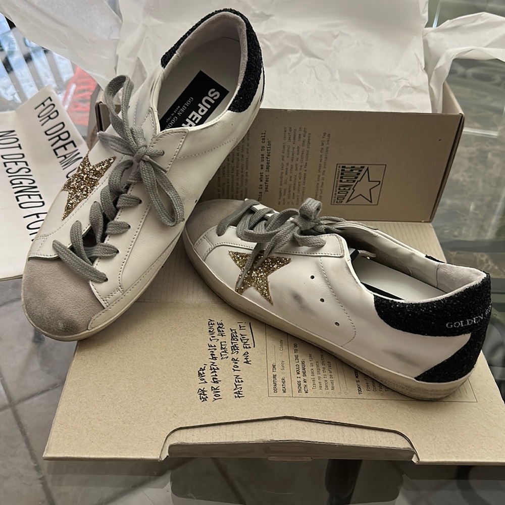 100% Authentic Golden Goose.  Glitter gold star and glitter black on the back.